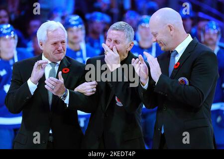 Former Toronto Maple Leafs players and members of the Hockey Hall of Fame  Börje Salming, left, and Mats Sundin take part in a ceremony before an NHL  hockey game between the Maple