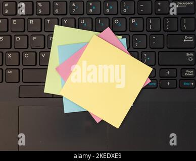 Colorful blank sticky note on a laptop Stock Photo