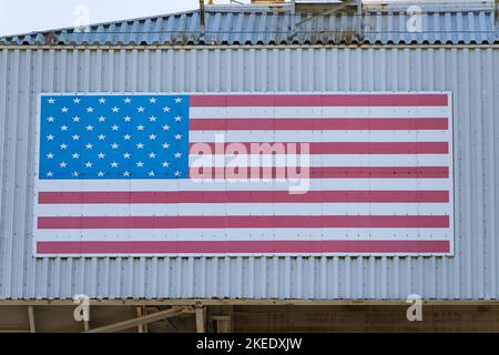 Nov 10, 2022; Lompoc, CA, USA;  A general view of the United States flag mounted on top of the Mobile Service Tower (MST) housing the United Launch Al Stock Photo