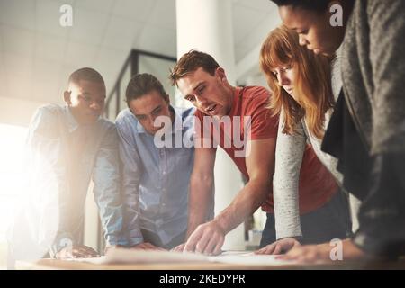Building success together. architects working together on a project in an office. Stock Photo