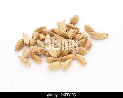 Cardamom capsules on a white background, healthy food and spices Stock Photo