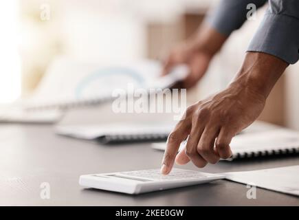 Finance, budget and hand with calculator for planning, financial strategy or accounting in small business. Accountant, audit or taxes on desk with Stock Photo