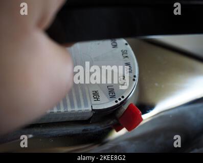 Marks showing the degrees of ironing on an old iron. Selected focus. Stock Photo