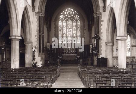 Interior of St Edmund's Church, Hunstanton, Norfolk looking east, from a postcard dated circa 1930s. The church was designed by Frederick Preedy and building works commenced in 1865. The original design called for a north west tower, but this was never built due to lack of funds. Stock Photo