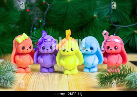 Handmade soap in the form of bright cute bunnies and rabbits New Year atmosphere. Stock Photo