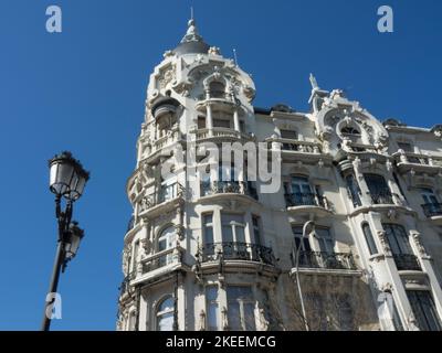 A low angle of the House of Gallardo and a street lamp in Madrid, Spain. Stock Photo