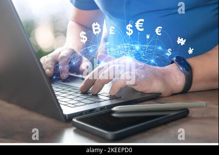 FinTech Financial Technology, internet payment, money exchange, digital banking concept. Man using laptop with hologram world currencies icons and bit Stock Photo