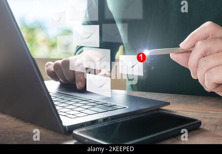 man using laptop pc with push notifications for incoming emails. businessman processes incoming calls, letters on laptop. customers send letters order Stock Photo