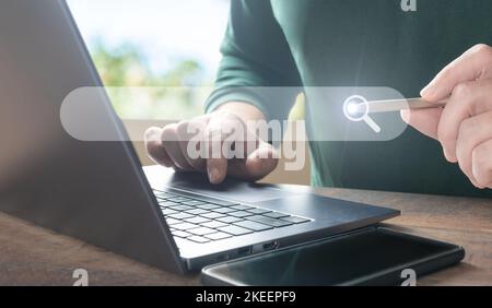 man using laptop, searching web, browsing information. Data Search Technology SEO Search Engine Optimization concept. Data search technology, engine o Stock Photo