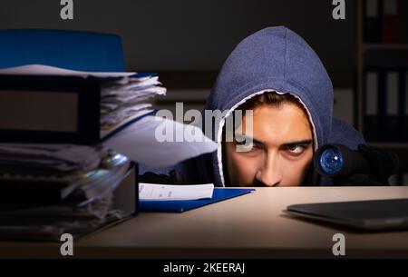 The thief trying to steal personal data in identity theft concept Stock Photo
