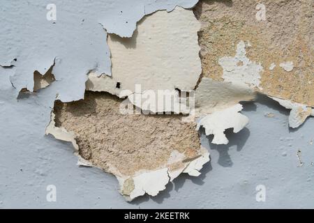 Close-up view of the wall paint peeling off. Stock Photo