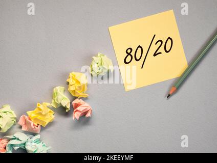 80 20 pareto rule concept, written on paper note. Stock Photo