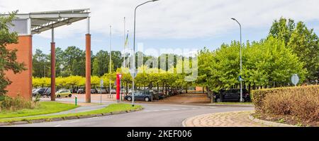 Zuidhorn, The Netherlands - September 25, 2022: City hall and green parking place in Zuidhorn municipality Groningen province in the Netherlands Stock Photo