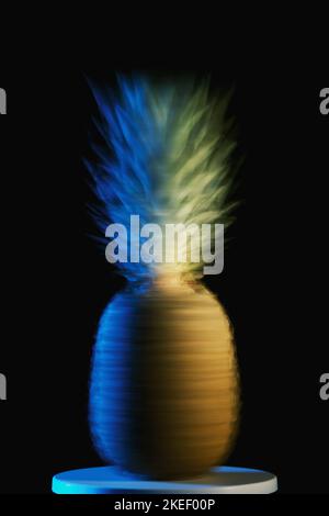 Spinning abstract photo of a pineapple on a black background. Stock Photo