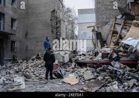 Mykolaiv, Ukraine. 11th Nov, 2022. Residents were seen staring at the rubble after the attack. A Russian missile attack on a residential building in the Inhulskyi district of Mykolaiv, a southern city in Ukraine. The deadly attack killed at least 7. Mykolaiv is a city 50 km away from Kherson city, where the Ukrainian force has gained a huge battlefield success in the past couple of days. Credit: SOPA Images Limited/Alamy Live News Stock Photo