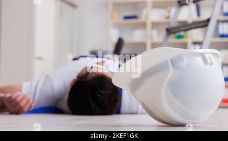 The worker after falling from height - unsafe behavior Stock Photo