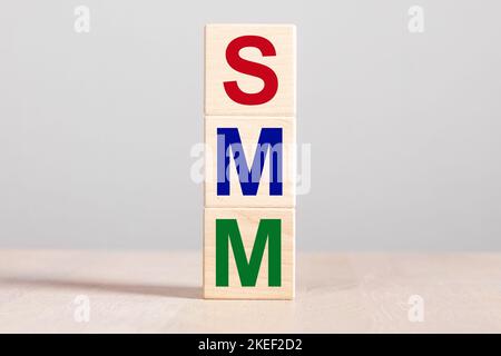 SMM acronym for Social Media Marketing in internet online media concept. Colorful letters on cubes. High quality photo Stock Photo