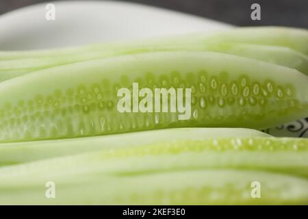 close up of slice of cucumber in a bowl on table  Stock Photo