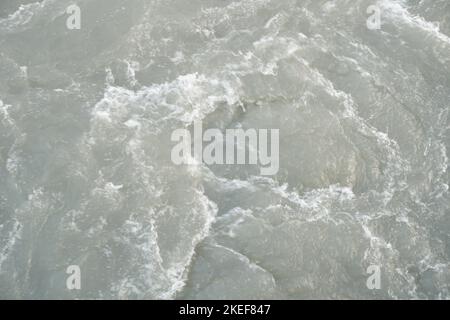 Fast moving whisky water on current stream river waves in the river ...