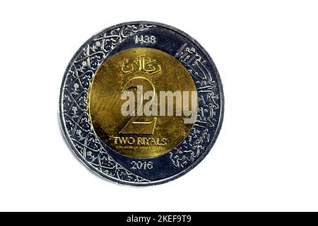 Reverse side of 2 SAR two Saudi Arabia riyals coin series 1438 AH 2016 with multiple coat of arms within the floral ornamentation and inscription of t Stock Photo