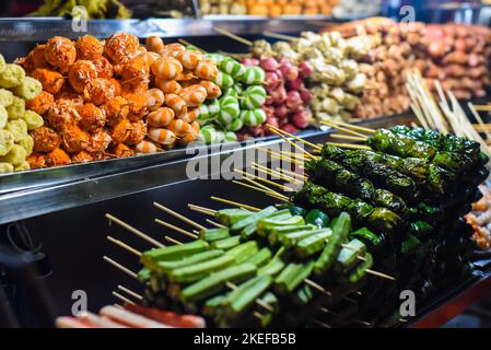 Many snacks and seafood in vietnamese night market in Da Lat Stock Photo