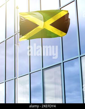 Flag of Jamaica on a flagpole Stock Photo