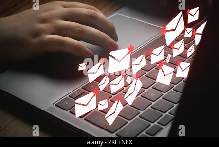 Woman using laptop with mail spam interface. Protection technology against phishing, scam and hacker. Internet cyber security. Stock Photo