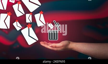 Woman hand throwing mail spam to digital trash can. Protection technology for phishing. Internet cyber security. Stock Photo