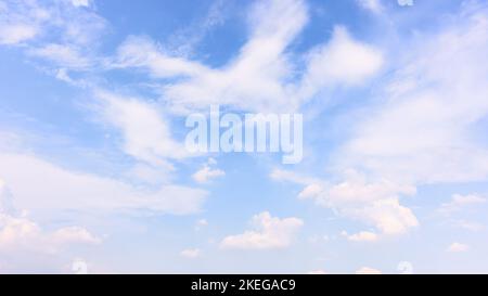 Bright blue sky with light clouds - background, panoramic cloudscape Stock Photo