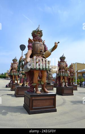 Milan, Italy - June 29 2015: Statue of Enolo winemaker standing in a group of statues of The Food People by Dante Ferretti at the Milan Expo 2015. Stock Photo