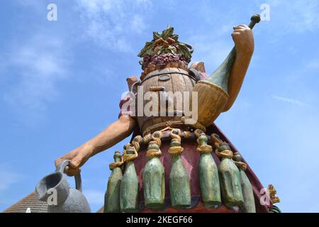 Statue of Enolo winemaker standing in a group of statues of The Food People by Dante Ferretti at the Milan Expo 2015. Stock Photo