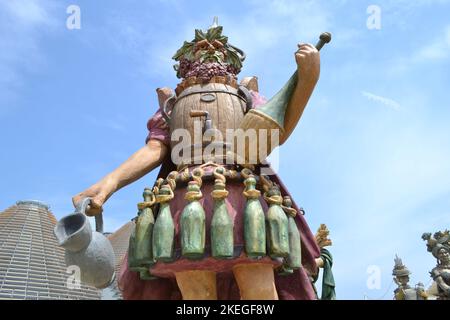 Statue of Enolo winemaker standing in a group of statues of The Food People by Dante Ferretti at the Milan Expo 2015. Stock Photo