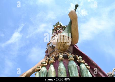 Statue of Enolo winemaker standing in a group of statues of The Food People by Dante Ferretti at the Milan Expo 2015. Stock Photo