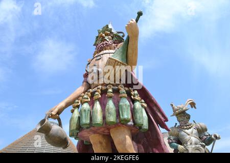 Statue of Enolo winemaker standing in a group of statues of The Food People by Dante Ferretti at the Milan Expo 2015. Stock Photo