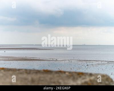 Pastel coloured beach view over low tide at Shoeburyness Stock Photo