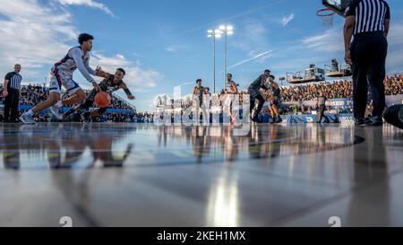 San Deigo, United States of America. 11 November, 2022. Gonzaga Bulldogs Guard Rasir Bolton, #45, drives past Michigan State Spartan Guard Tyson Walker, #2, during the 2022 ESPN Armed Forces Classic Carrier Edition, held on the flight deck of the Nimitz-class aircraft carrier USS Abraham Lincoln at Naval Air Station North Island, November 11, 2022 in San Diego, California. Gonzaga Bulldogs beat the Michigan State Spartans 64-63. Credit: MC2 Madison Cassidy/US Navy Photo/Alamy Live News Stock Photo