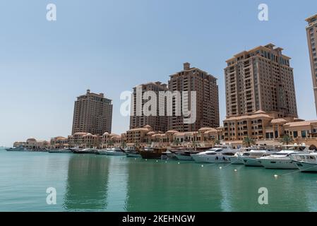 THE PEARL, QATAR - APRIL 4, 2018: View of the Porto Arabia section of The Pearl's massive residential development in West Bay, Doha, Qatar. Accommodat Stock Photo