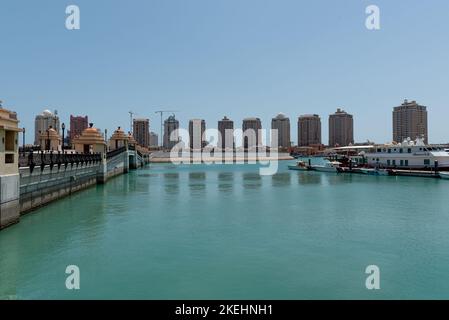 THE PEARL, QATAR - APRIL 4, 2018: View of the Porto Arabia section of The Pearl's massive residential development in West Bay, Doha, Qatar. Accommodat Stock Photo