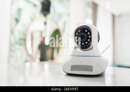 Security camera high tech smart home security technology digital on the table or shelf copy space Stock Photo
