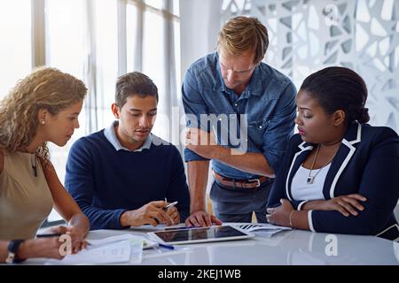 This is what Ive been working on...a group of colleagues working together in an office. Stock Photo