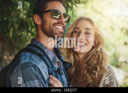 Staying in on the weekends Not us. a happy young couple spending time together in nature. Stock Photo