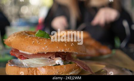 Appetizing delicious breakfast. Sandwiches with meat in a street cafe. Fast food close up. Stock Photo