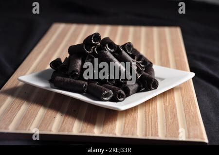 Vanilla wafer sticks on a plate Stock Photo