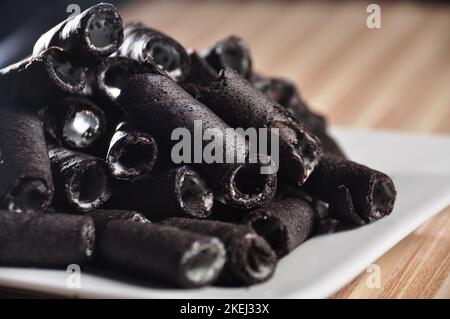 Vanilla wafer sticks on a plate Stock Photo