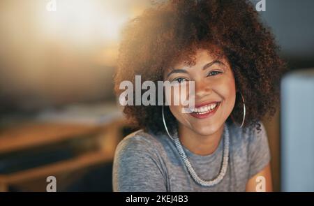 Working 8 till late. Portrait of a successful young woman working a late shift at the office. Stock Photo