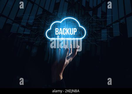 Data backup for data recovery to original or new location. Hologram in the form of a cloud over the hand Stock Photo