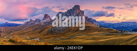 A wide 3:1 panoramic image from autumn in the Dolomites and a beautiful sunrise on the Giau Pass (Passo Giau) at 2200 meters altitude. Here you have a Stock Photo