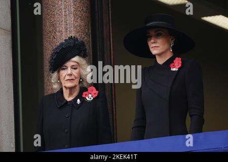 The Queen Consort and Princess of Wales stand on a balcony at the Foreign, Commonwealth and Development Office (FCDO) on Whitehall, during the Remembrance Sunday service at the Cenotaph in London. Picture date: Sunday November 13, 2022. Stock Photo