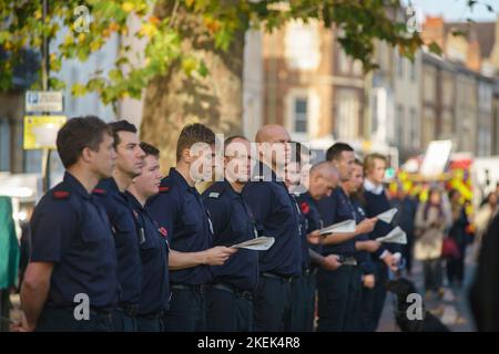 Oxford, UK. November 13th  People line St Giles (the main road into Oxford) to attend the Remembrance Day parade. Members of the Armed Forces, Girl and Boy Scouts, Cubs and emergency services were also present. The service took place at the war memorial at the entrance to the city. PICTURED: on-duty fire officers in attendance Credit: Bridget Catterall/AlamyLive News Stock Photo