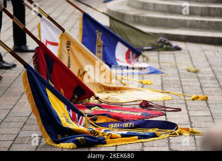 Standards are lowered by standard bearers as the Last Post is played ahead of a two minute silence during a Remembrance Sunday service and parade in Guildhall Square in Portsmouth. Picture date: Sunday November 13, 2022. Stock Photo